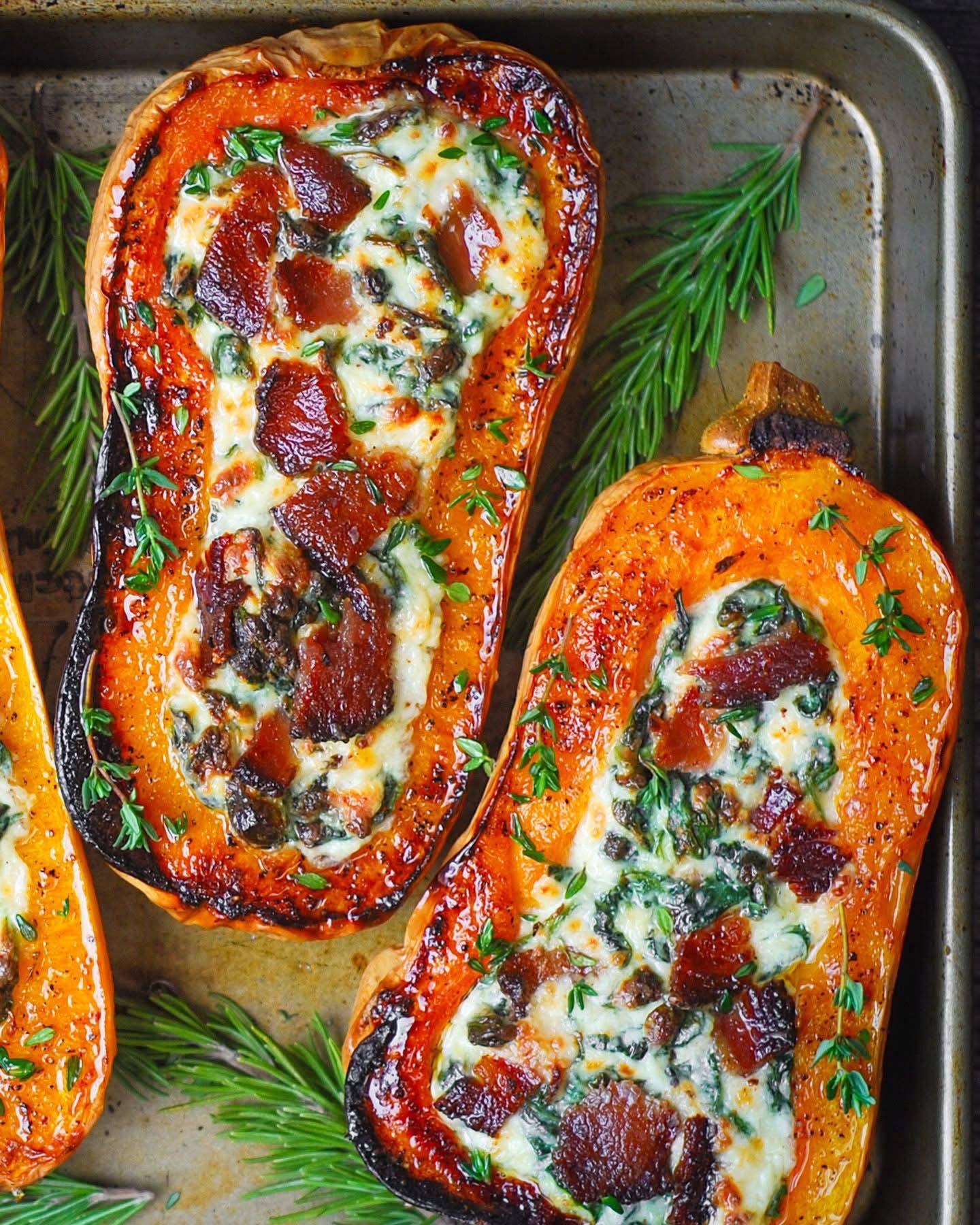 Stuffed Butternut Squash with Spinach, Bacon, and Cheese - on a sheet pan.