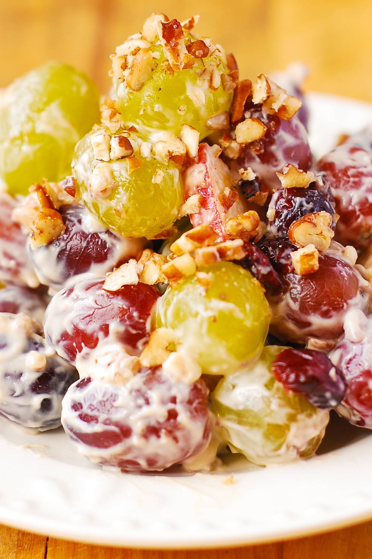 Creamy Vanilla Grape and Apple Salad with Cranberries and Pecans.