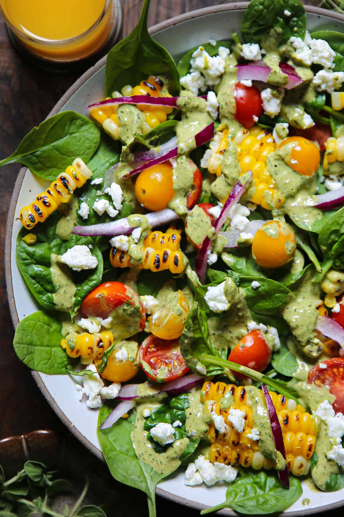 Corn Tomato Spinach Salad with Creamy Pesto Dressing.