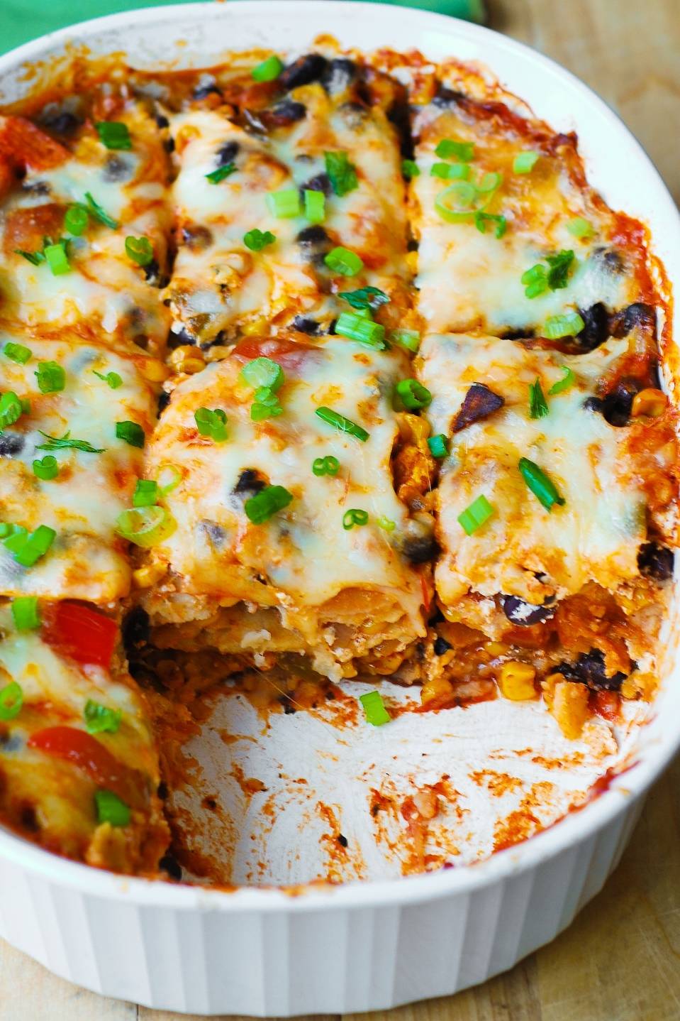 Black Bean and Butternut Squash Enchilada Casserole in a white casserole dish.