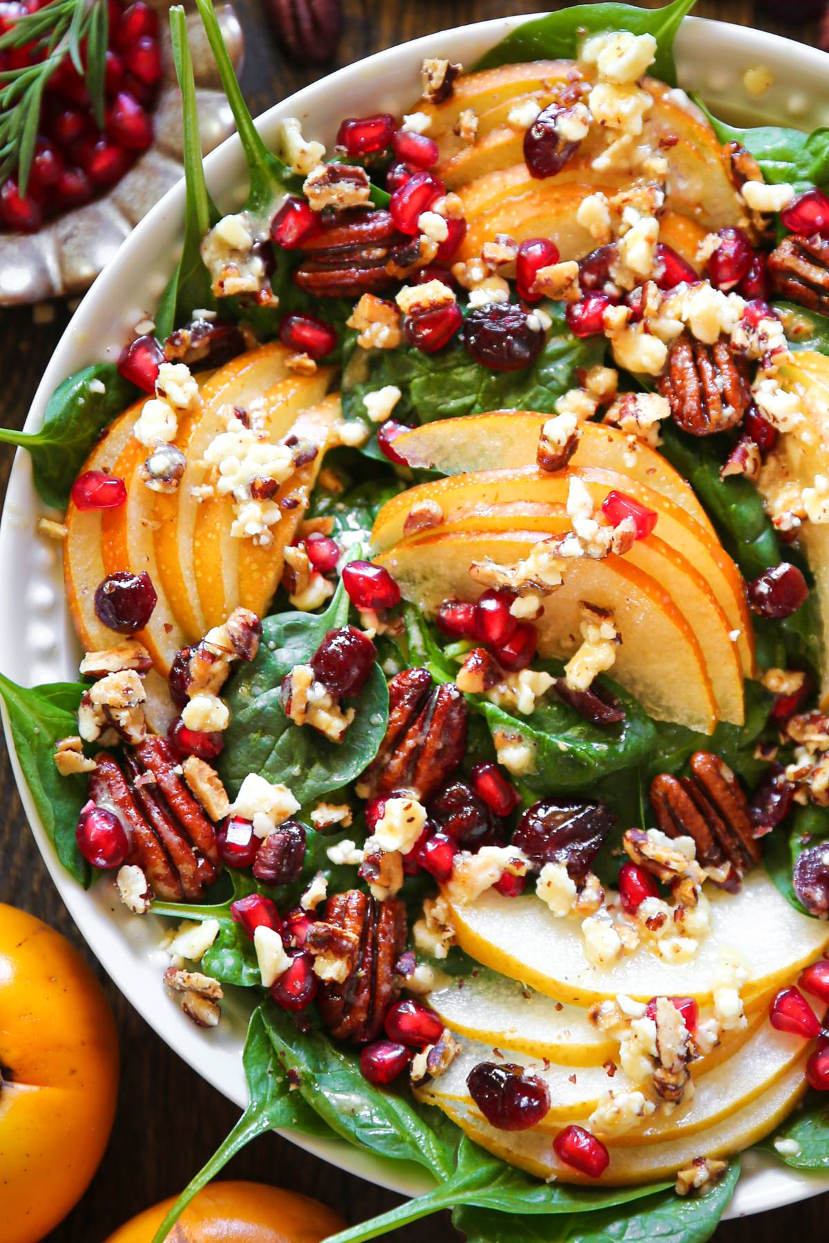 Pear & Pomegranate Spinach with Pecans, Dried Cranberries, Feta, and a Maple-Lemon Dijon Mustard Dressing.