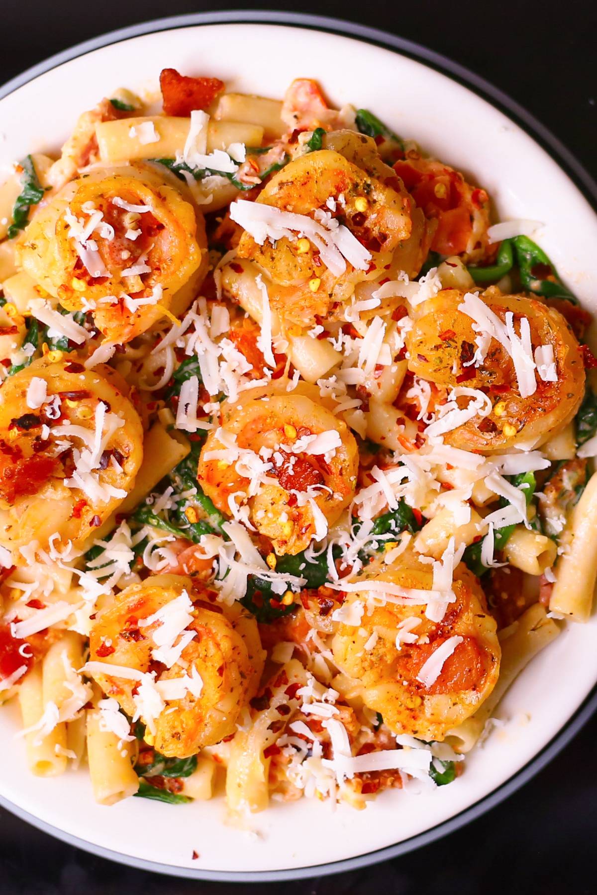 Creamy Pasta with Shrimp, Bacon, Spinach, Garlic, and Tomatoes.