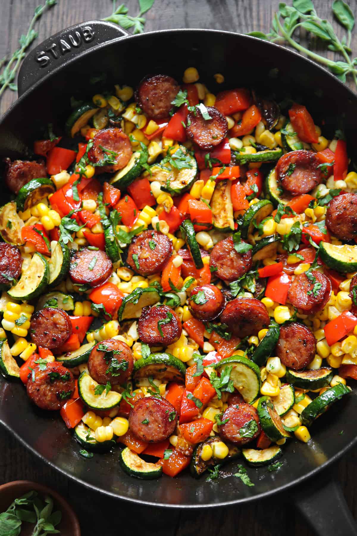 Sausage and Veggies Skillet (Zucchini, Bell Pepper, Corn) - in a cast iron skillet.