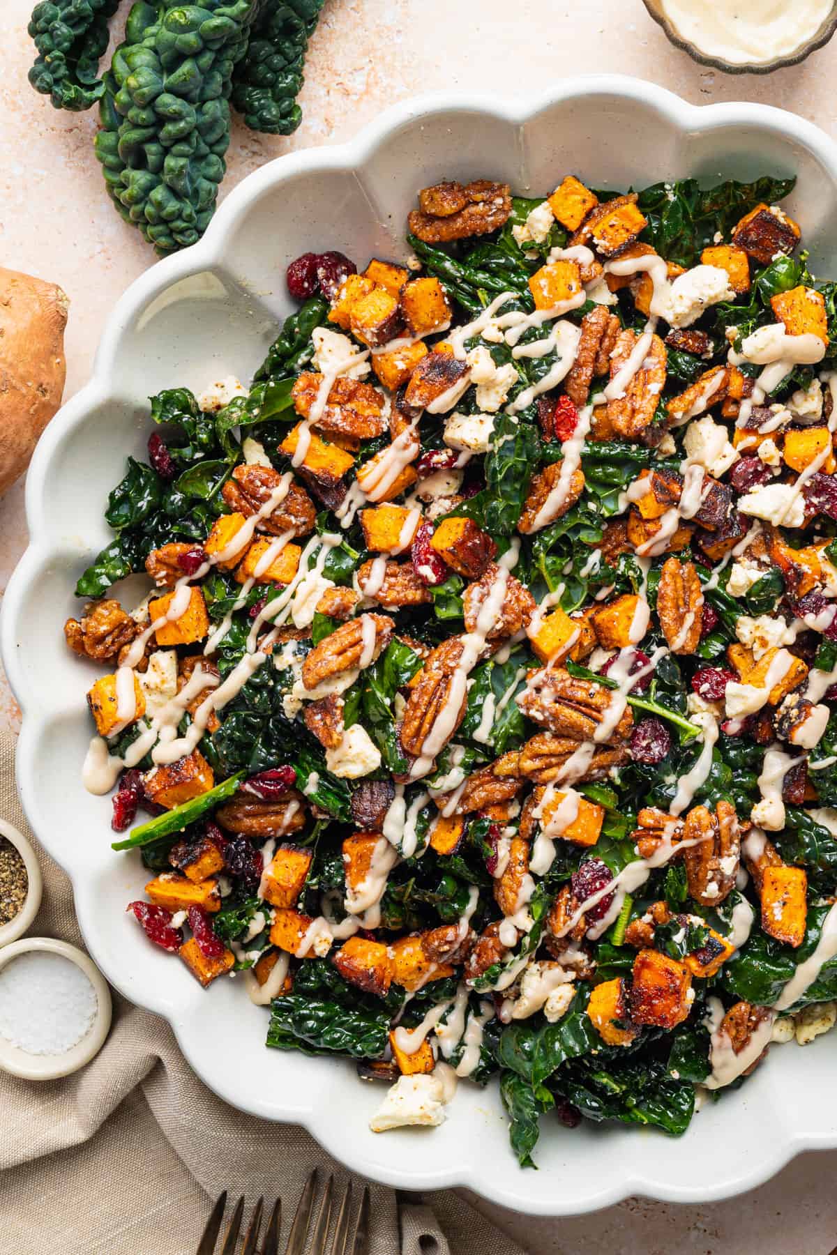Sweet Potato Kale Salad with Creamy Maple Dressing in a bowl.