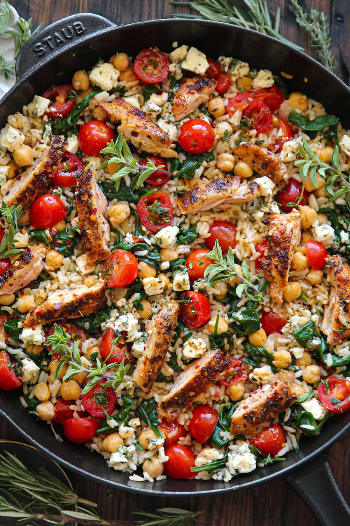 Greek Chicken and Lemon Rice in a cast iron skillet.