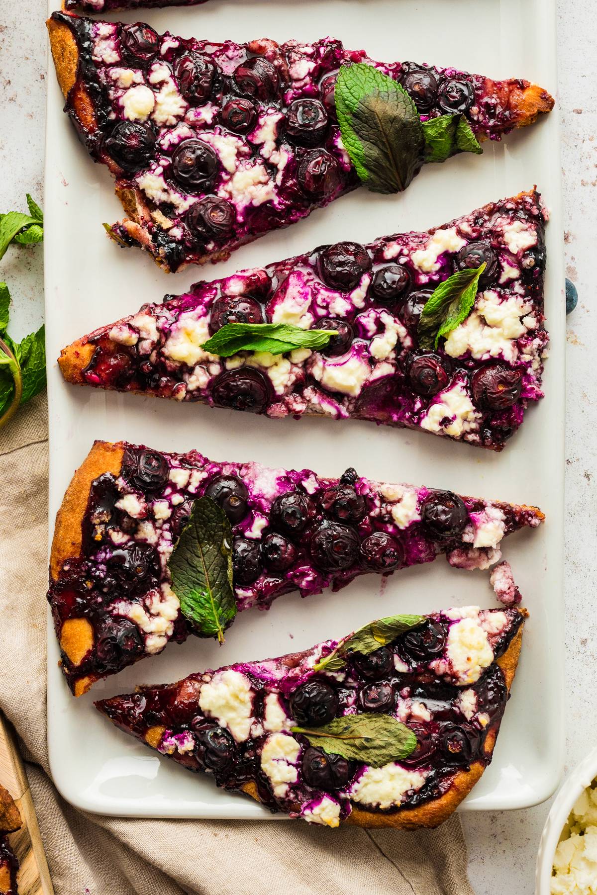 Blueberry Feta Flatbread with Feta and Mint Leaves.