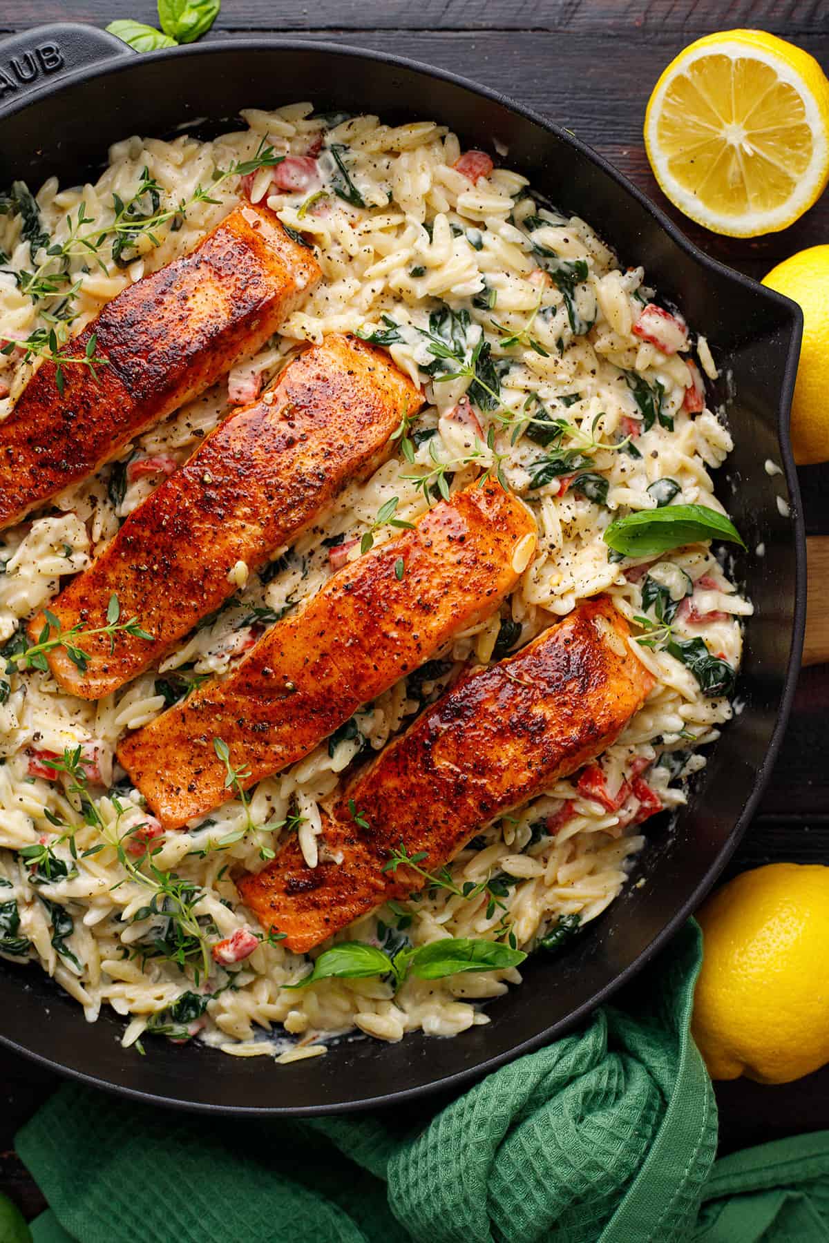 Creamy Salmon & Spinach Orzo in a cast iron skillet.