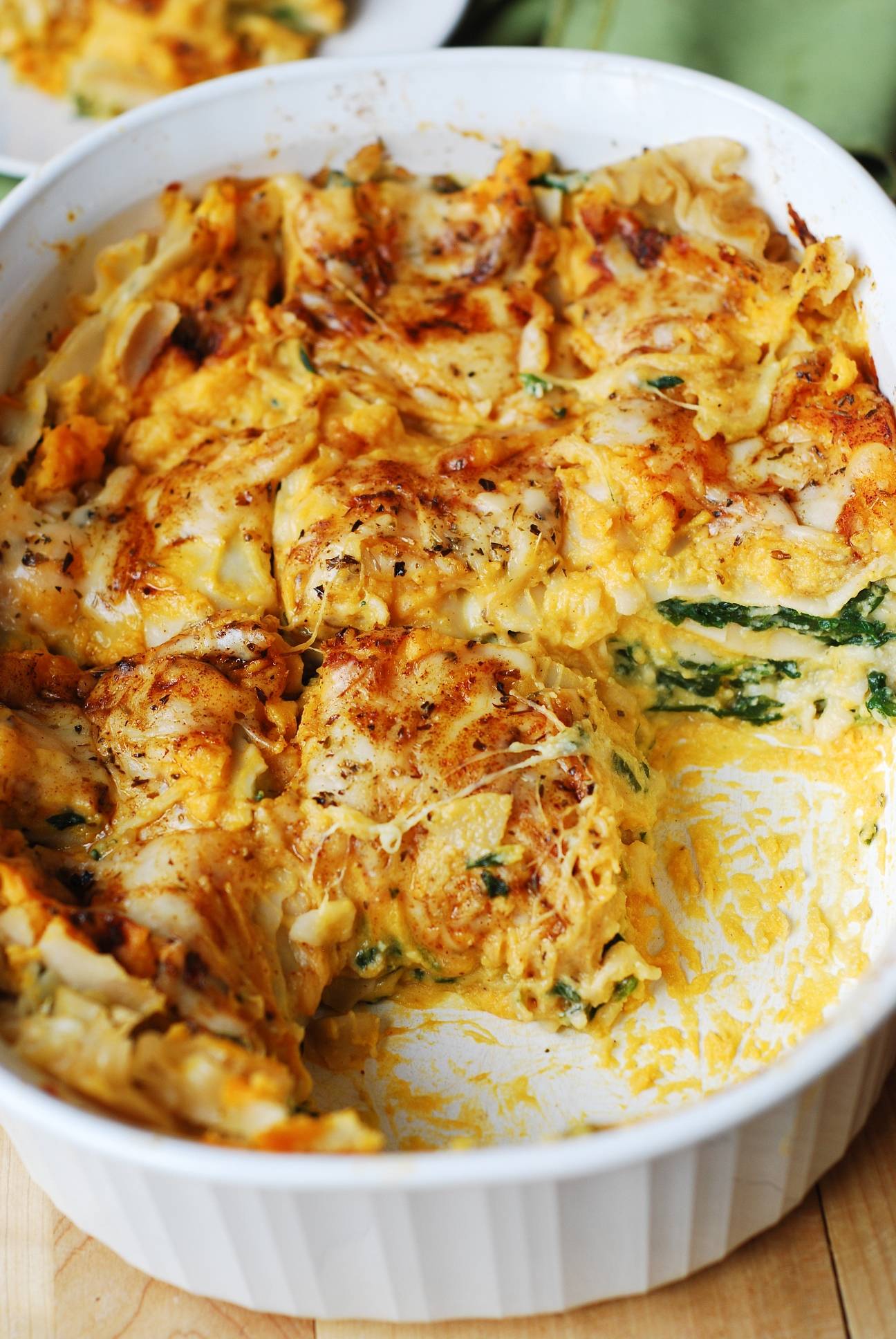Butternut Squash and Spinach 3-Cheese Lasagna in a white casserole dish.