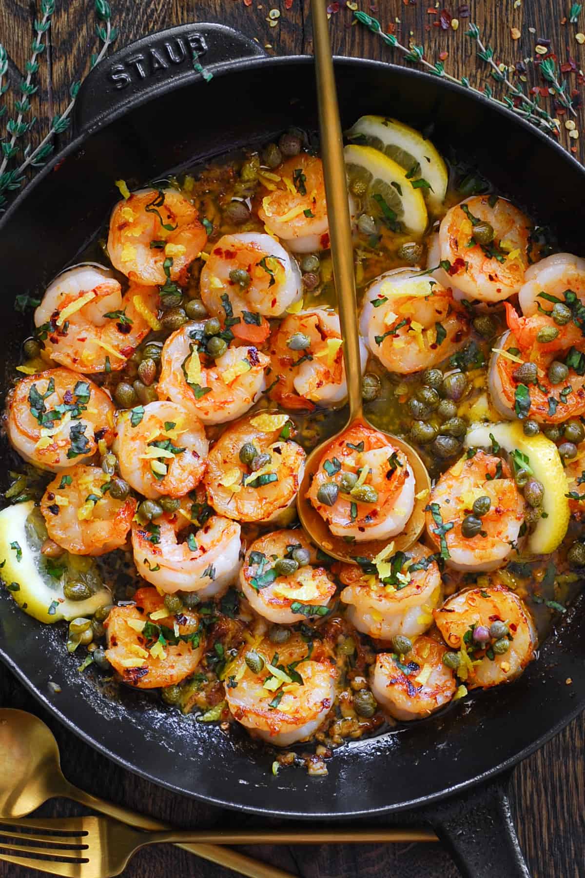 Shrimp Scamp with Lemon-Garlic-Butter-White-Wine Sauce and Capers in a cast iron skillet.