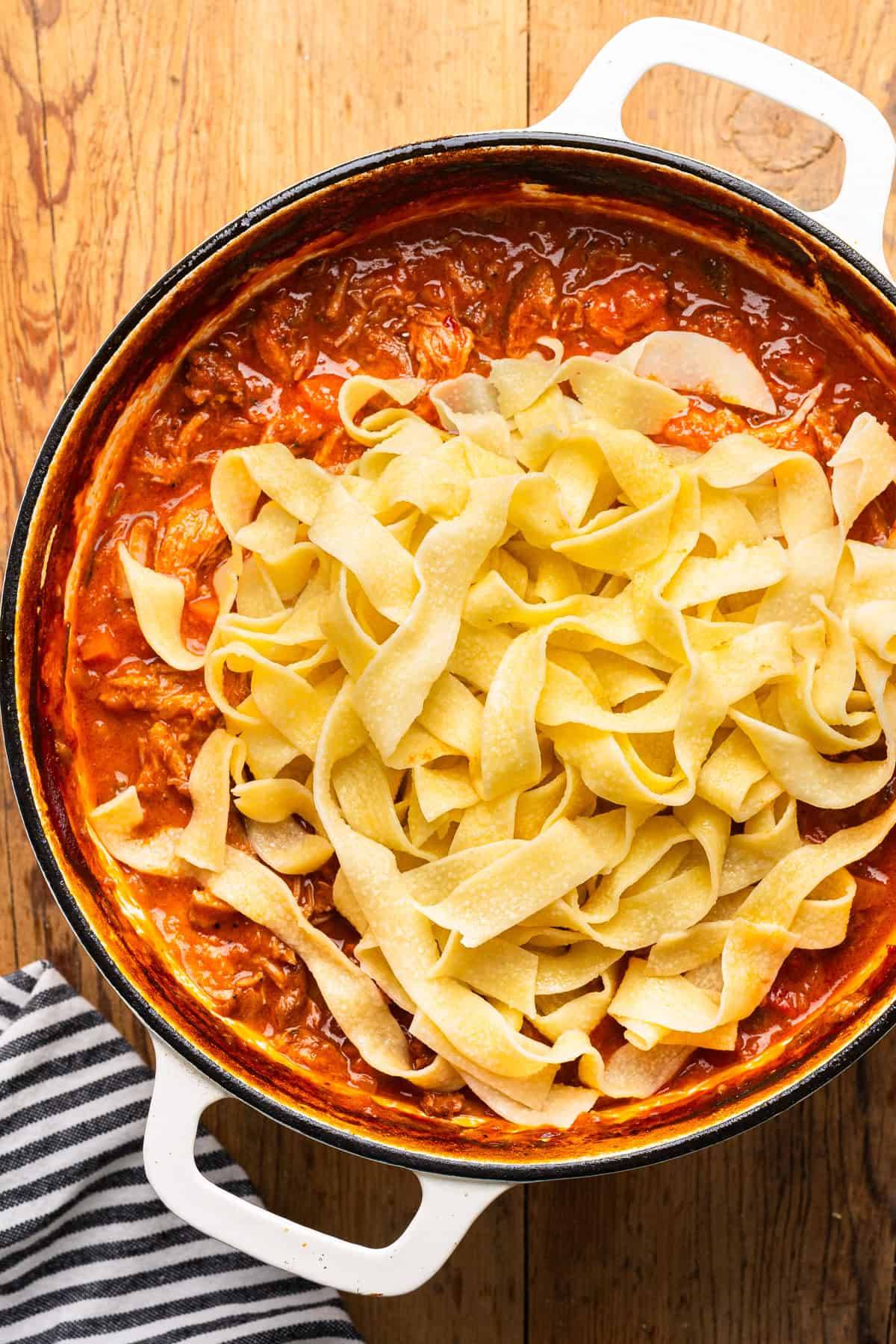 Braised Pork Ragu Pappardelle in a pot.