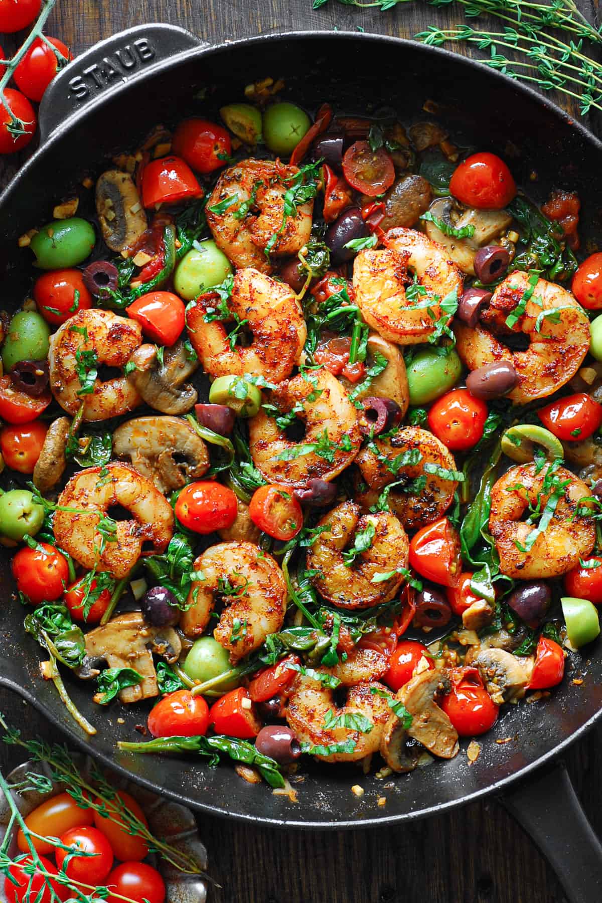 Mediterranean Shrimp (with paprika and Italian seasoning, alongside briny olives, juicy tomatoes, garlic, mushrooms, spinach, and a white wine sauce)