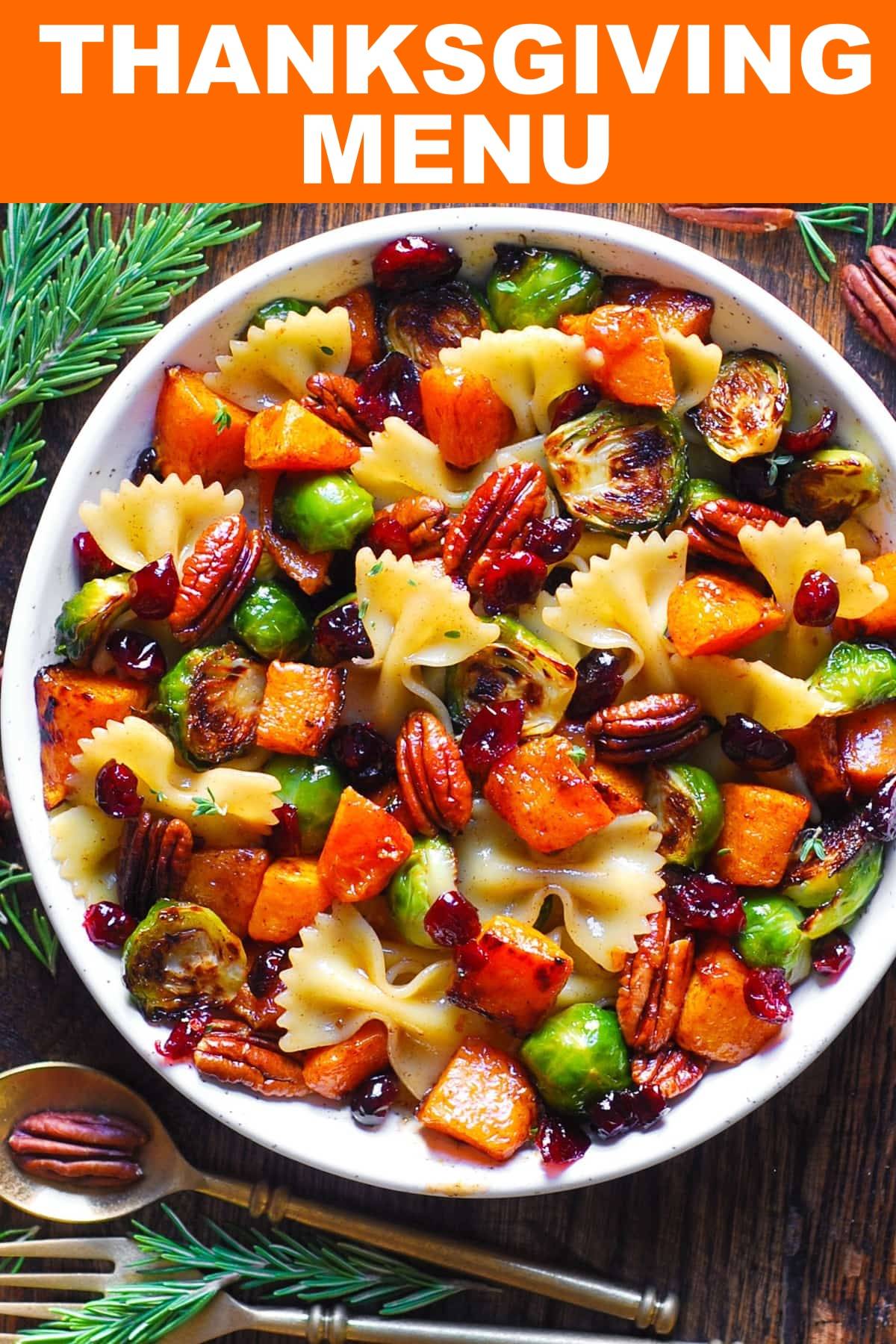 Pasta Salad with Roasted Butternut Squash, Brussels Sprouts, Pecans, and Dried Cranberries - in a white bowl.