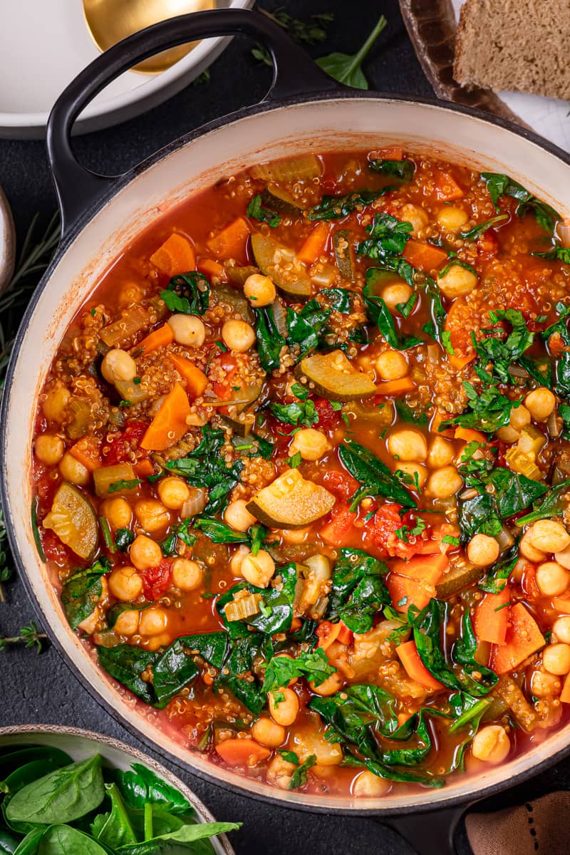 This one-pot vegetable quinoa soup is loaded with carrots, celery, zucchini, chickpeas, and baby spinach in a herb-infused tomato broth.