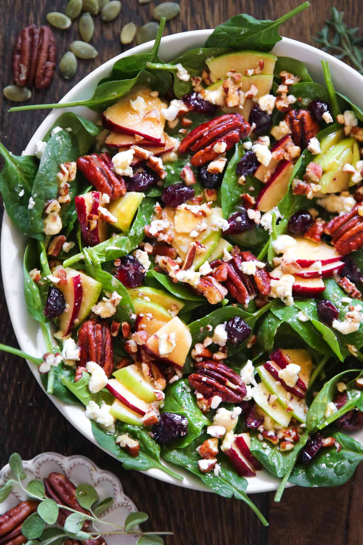Apple Spinach Salad with Maple-Lime Dressing - in a bowl.