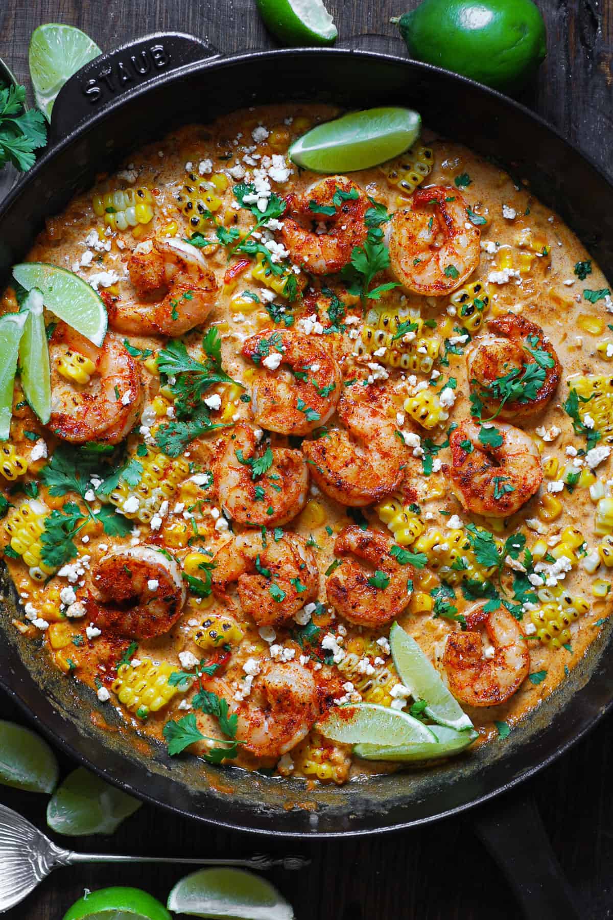 Shrimp and Creamed Corn in a cast iron skillet.