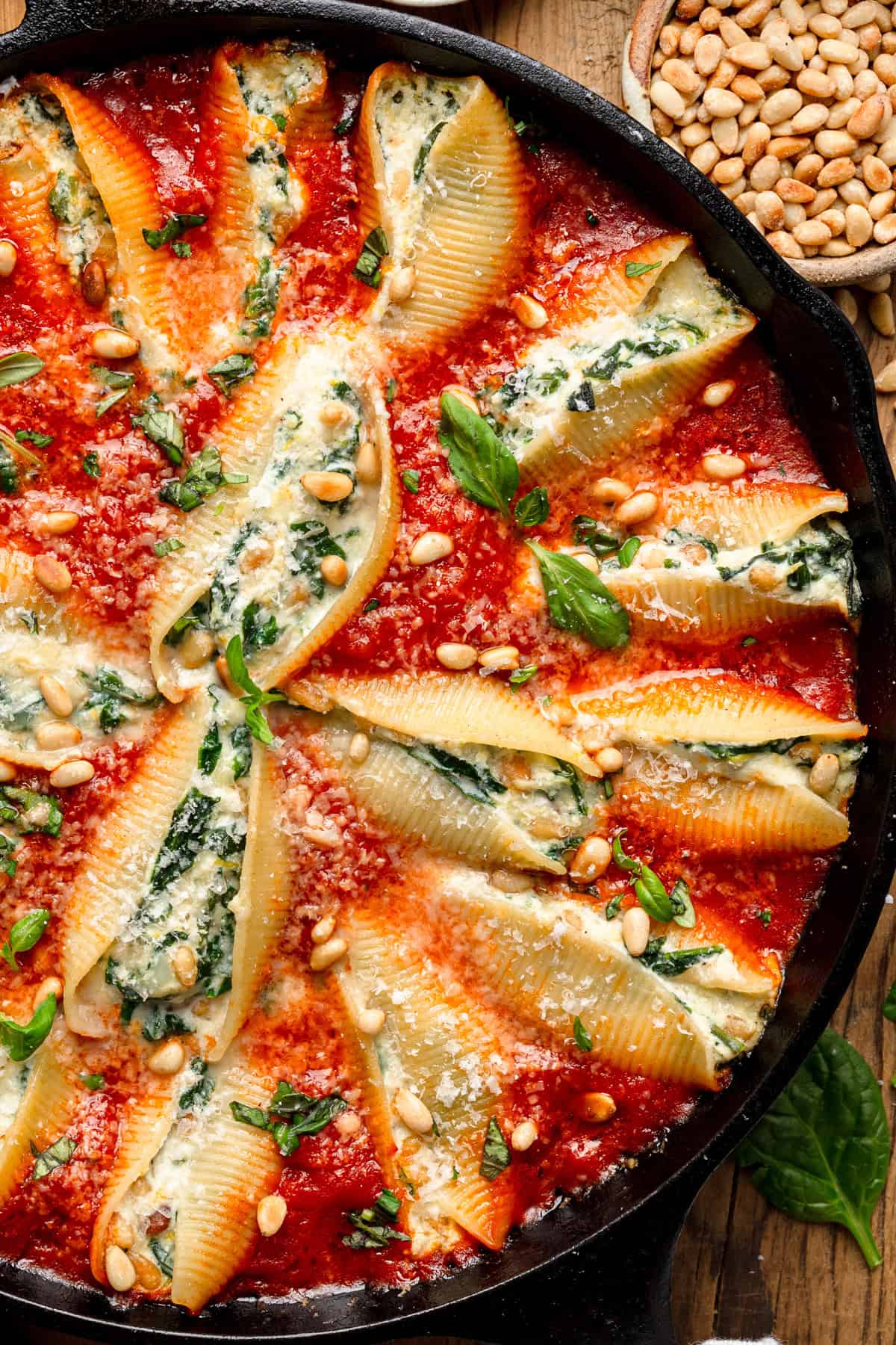 Stuffed Pasta Shells (a creamy mix of ricotta, mozzarella, parmesan, sautéed spinach, and nestled into a skillet of rich marinara sauce.)