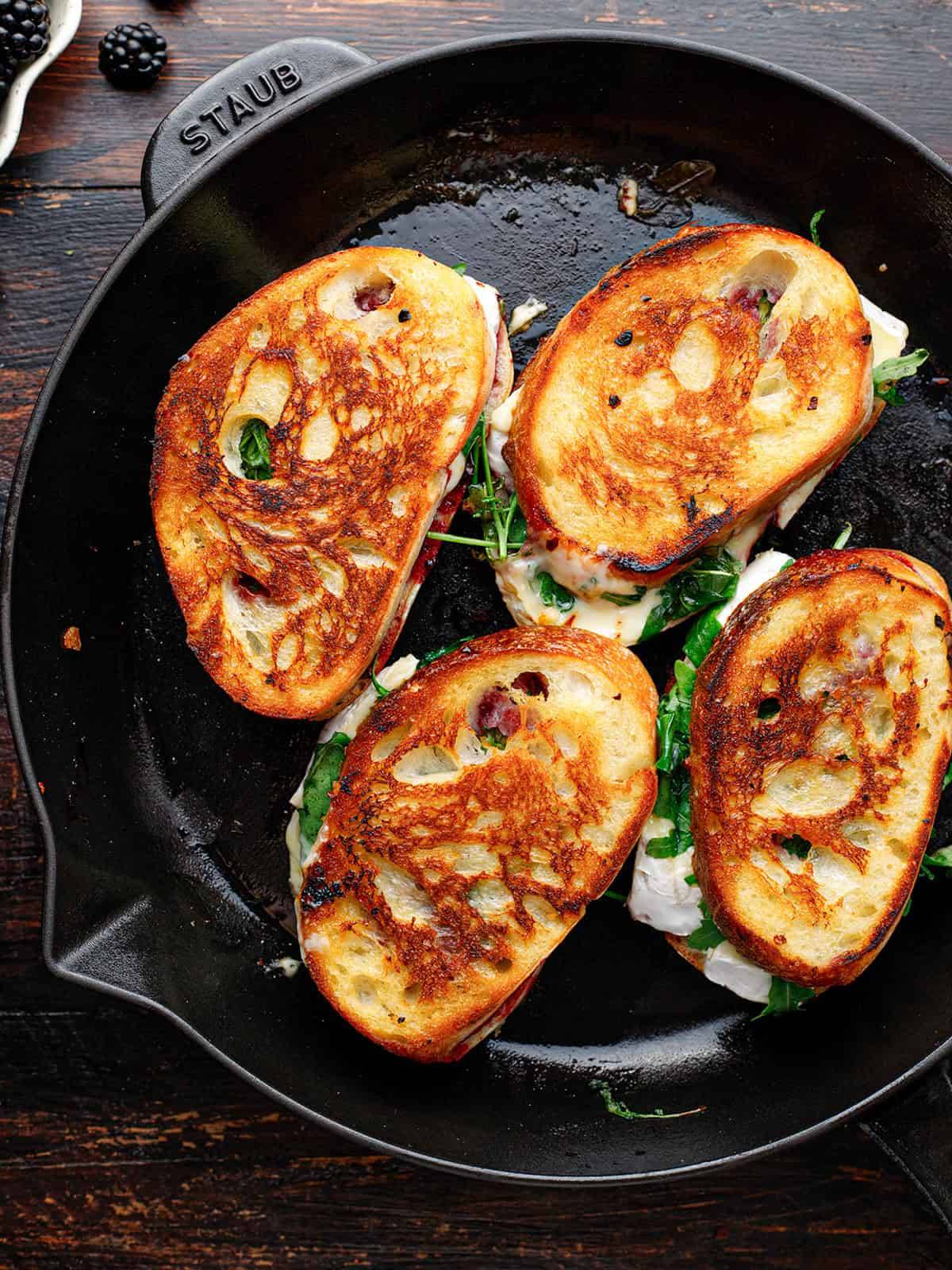 Blackberry Brie Grilled Cheese Sandwich in a cast iron skillet.