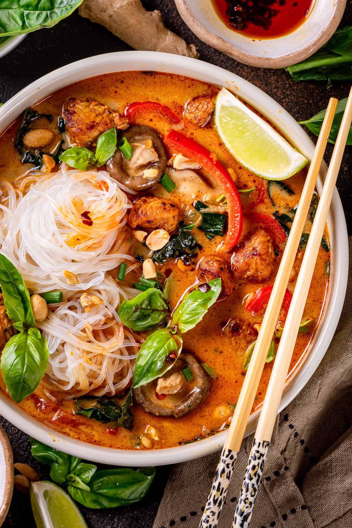 Thai Peanut Coconut Curry Chicken Noodle Soup in a bowl.
