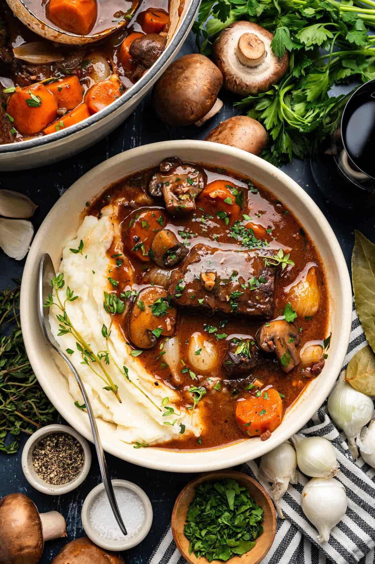 Beef Bourguignon (French Red-Wine Beef Stew) with Mashed Potatoes - in a bowl.