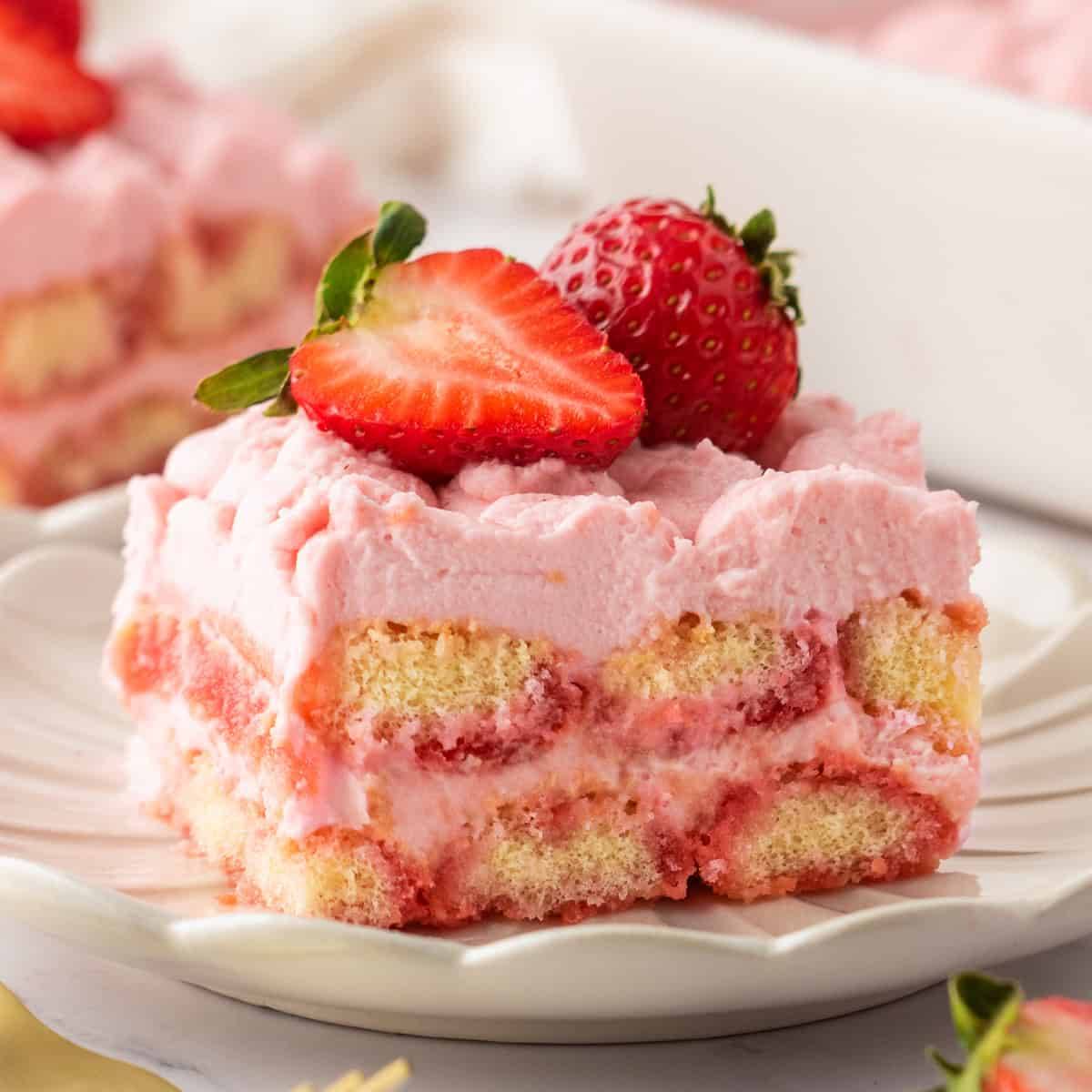 A slice of strawberry tiramisu on a plate.
