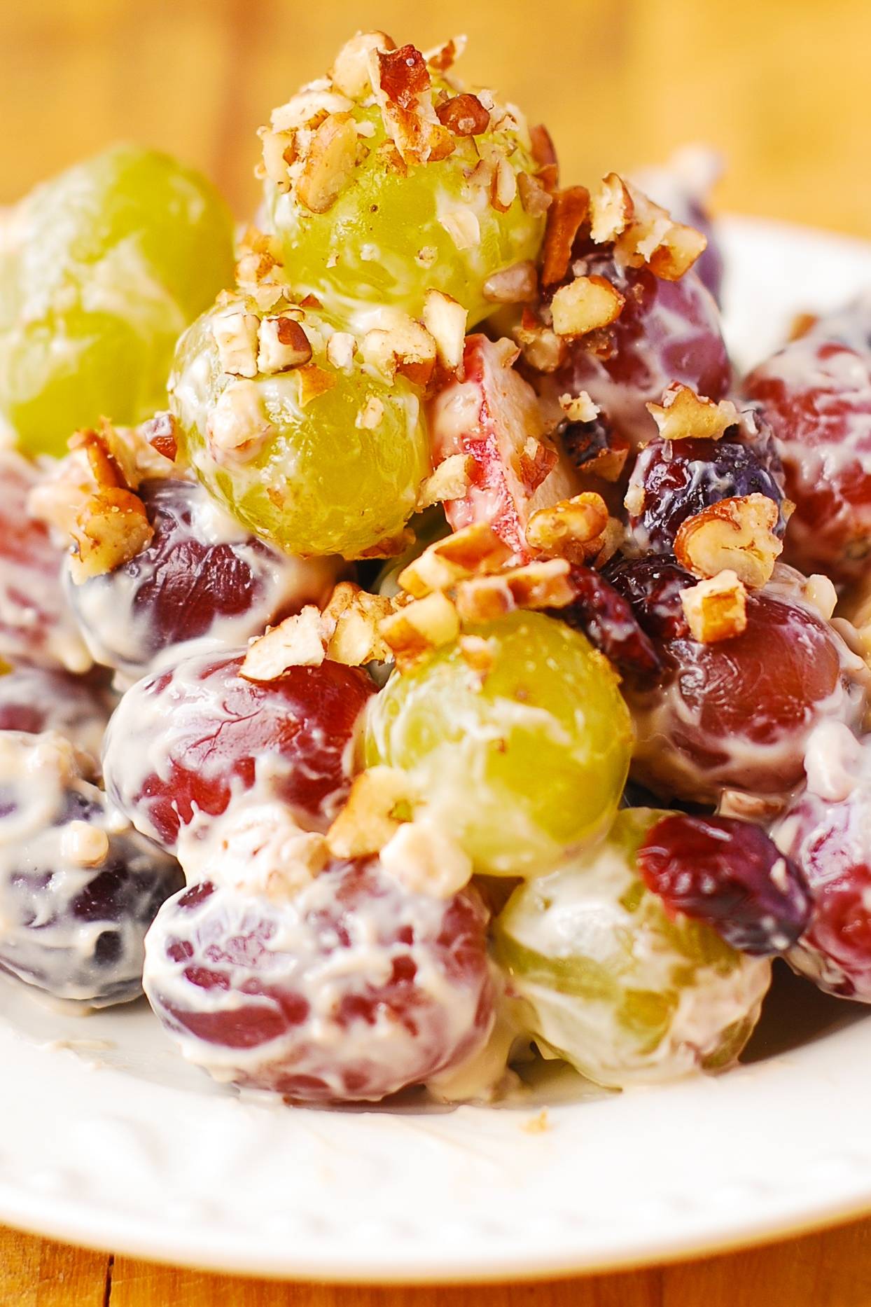 Grape Salad with Apples, Pecans, and Dried Cranberries on a plate.