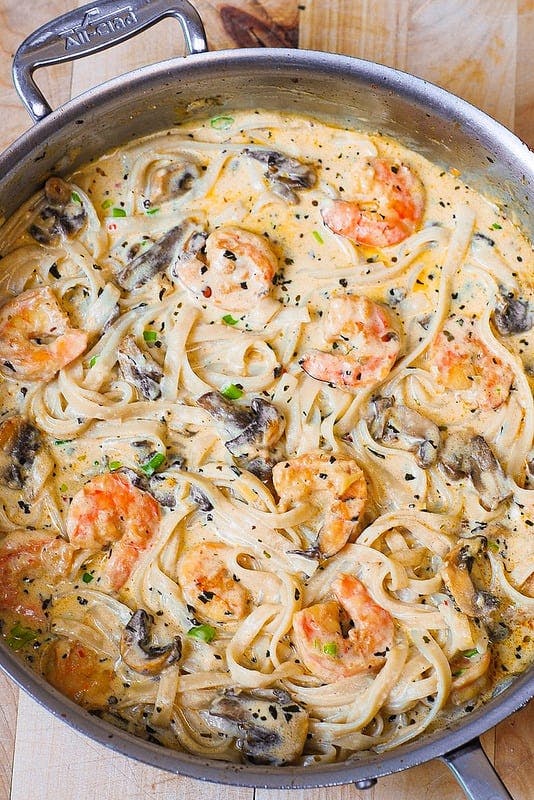 Creamy Shrimp Pasta with Mushrooms - in a stainless steel pan.