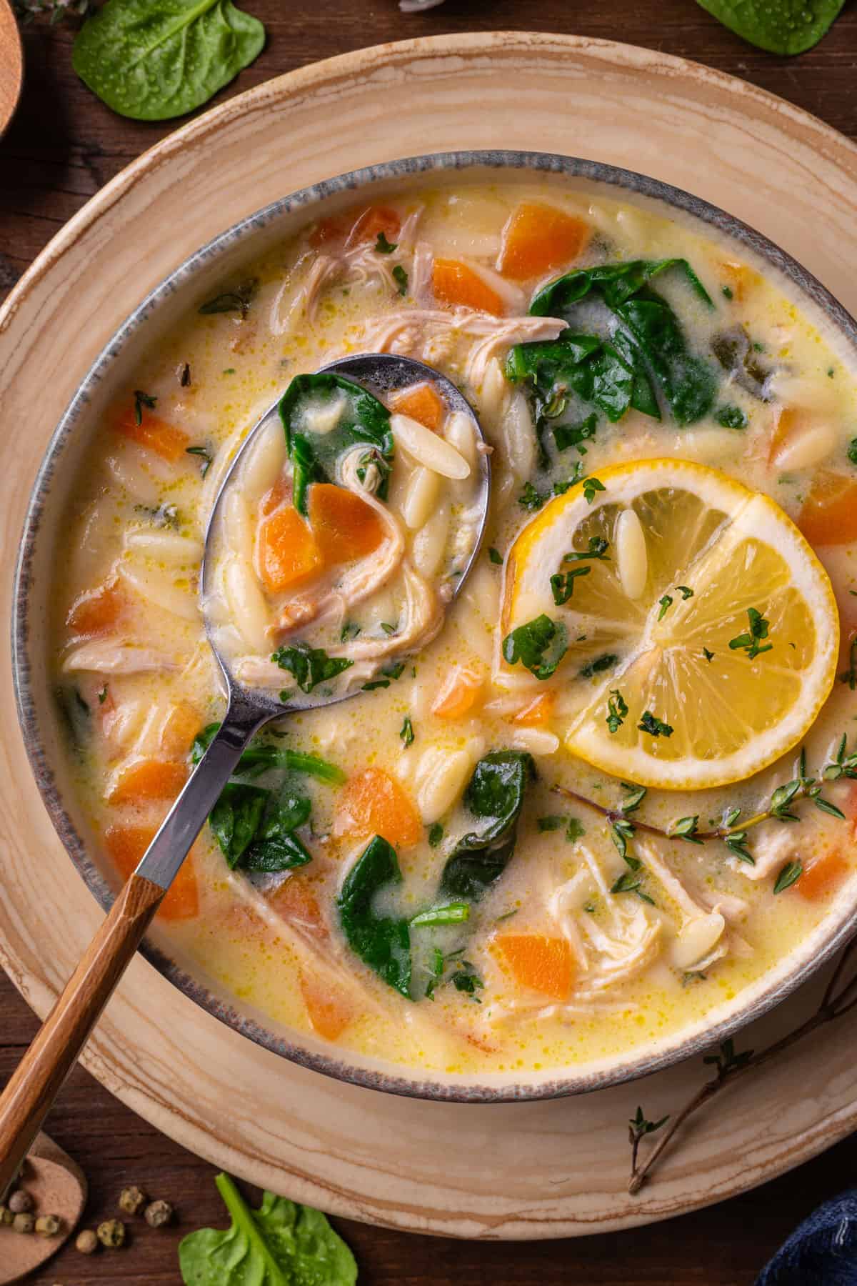 Lemon Chicken Orzo Soup with Spinach in a bowl.