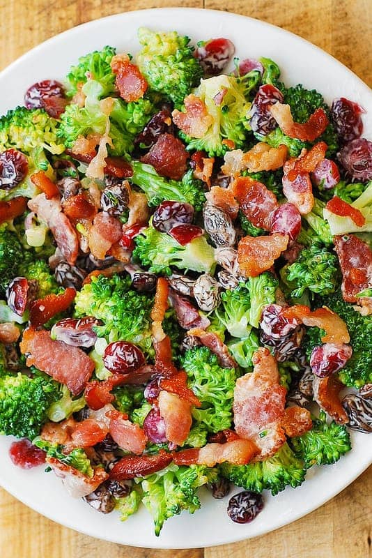 Creamy Broccoli Bacon Salad with Pecans, Cranberries, Raisins on a plate.