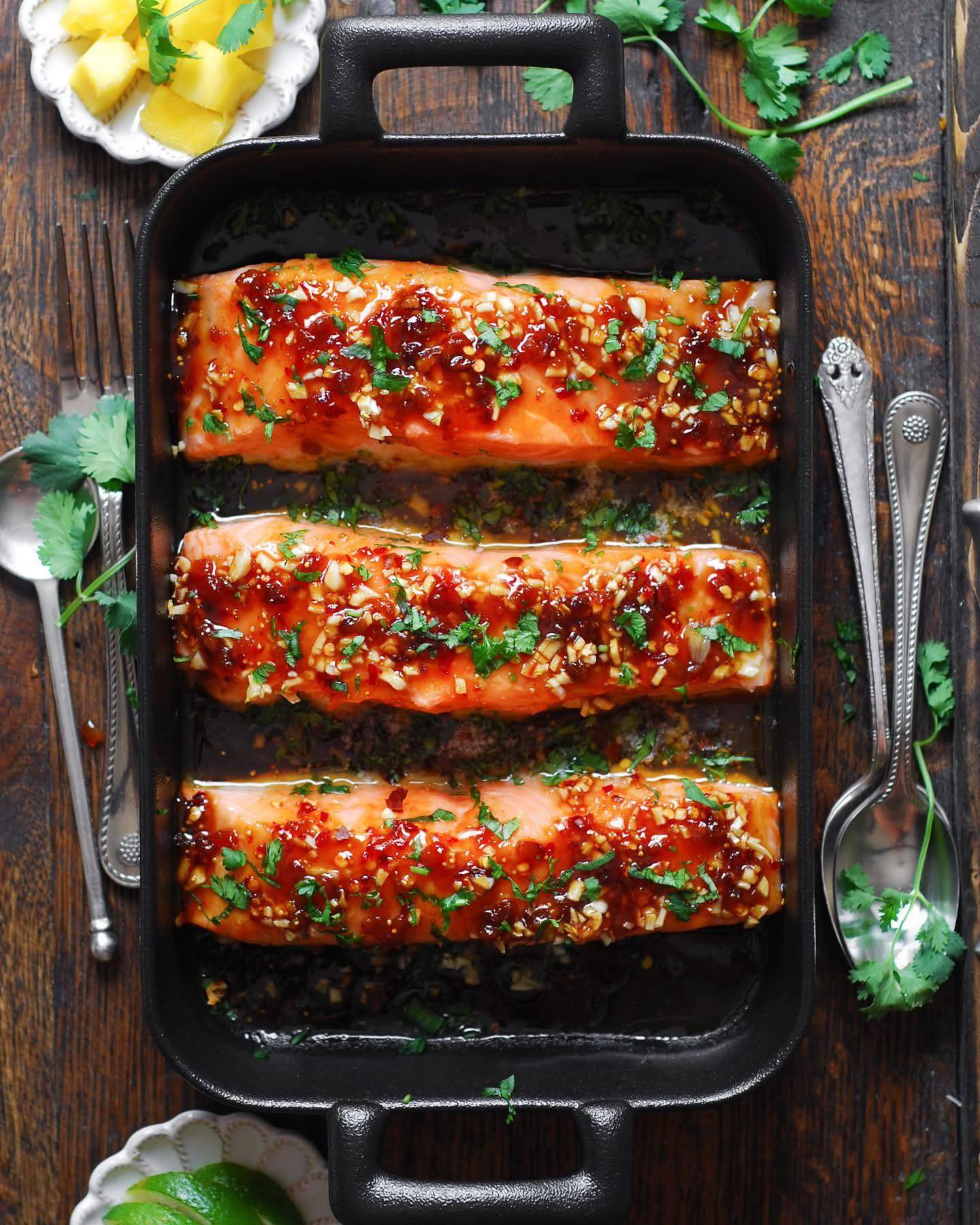 Honey Garlic Glazed Salmon with Chili Fig Spread in a baking dish.