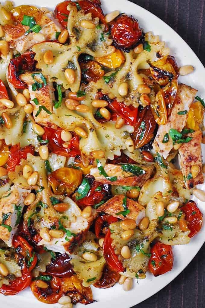 Creamy Basil Pesto Chicken Pasta with Roasted Cherry Tomatoes and Toasted Pine Nuts. 