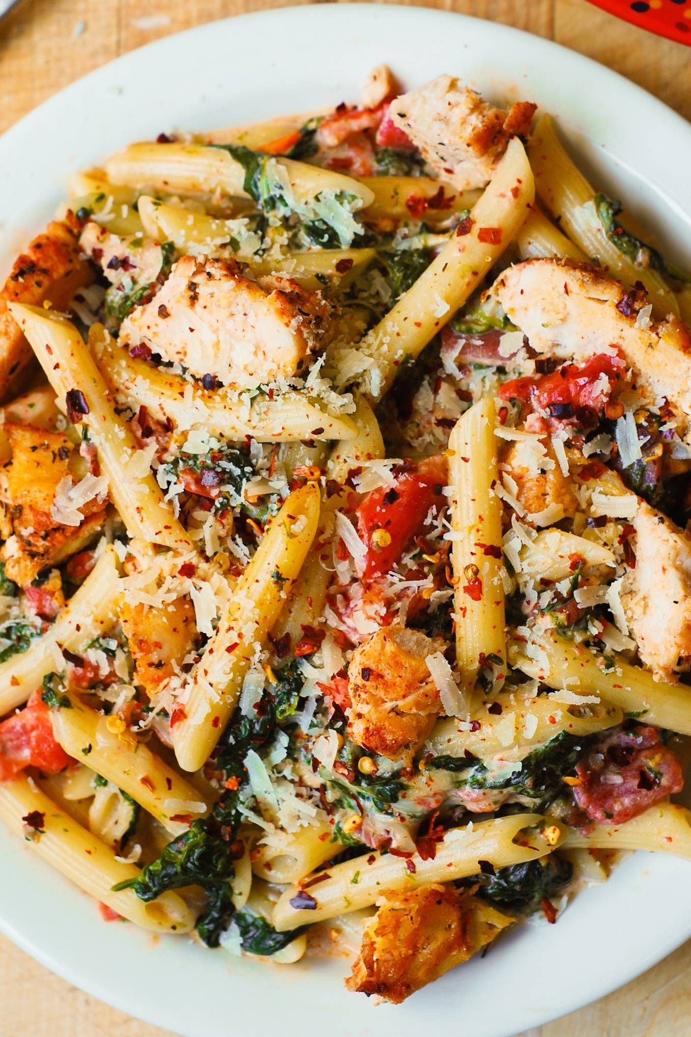Creamy Chicken and Bacon Pasta with Spinach and Tomatoes in Garlic Cream Sauce