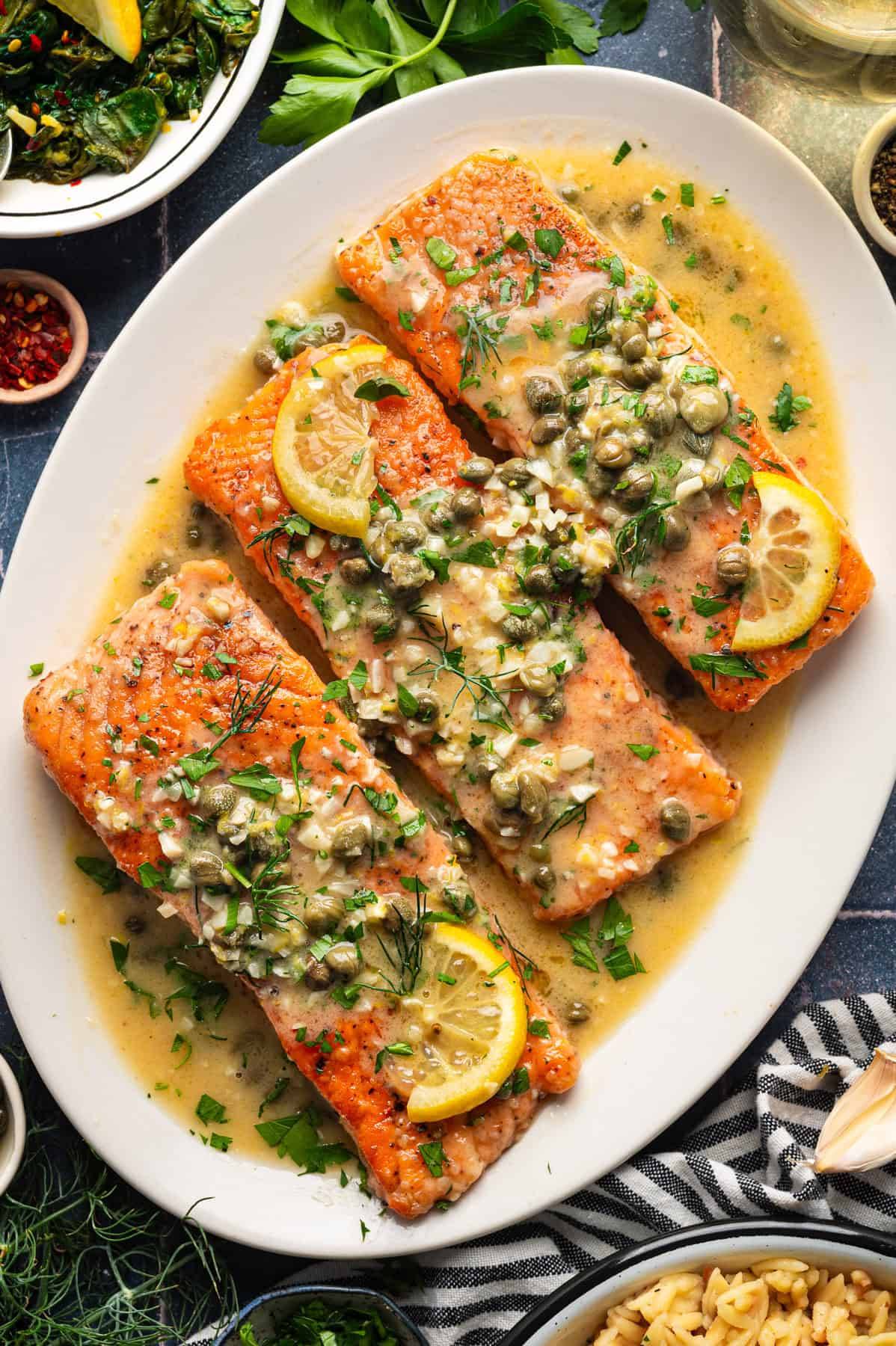 Lemon-Caper Salmon Piccata on a white plate.