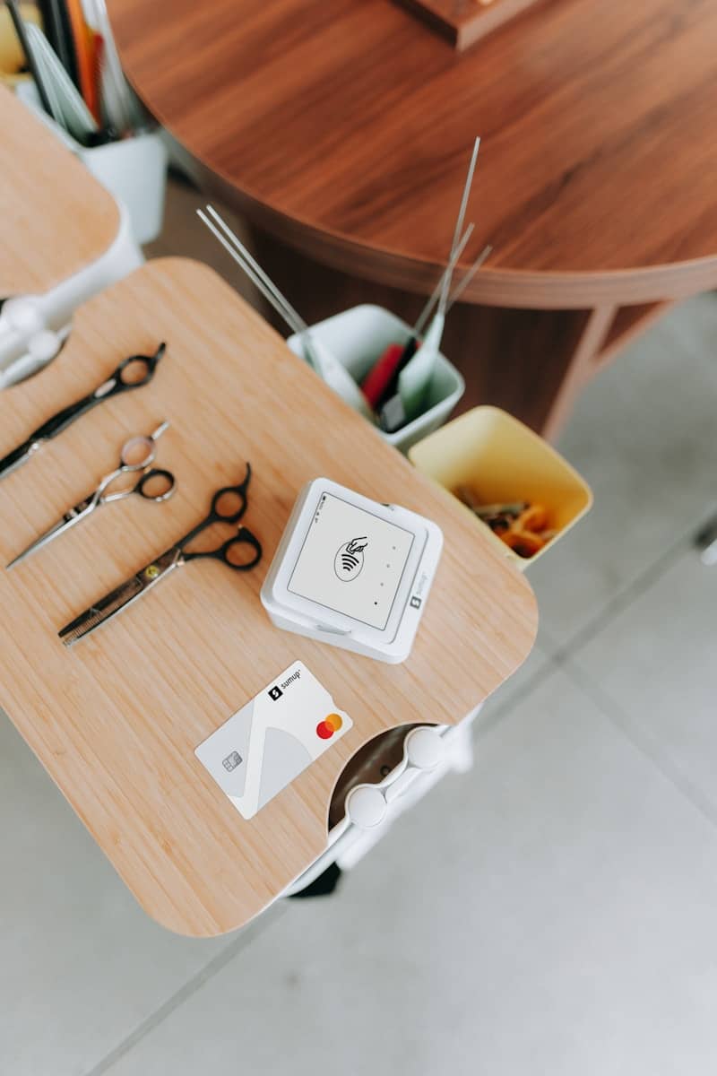 Haircutting tools and payment items are on a table.