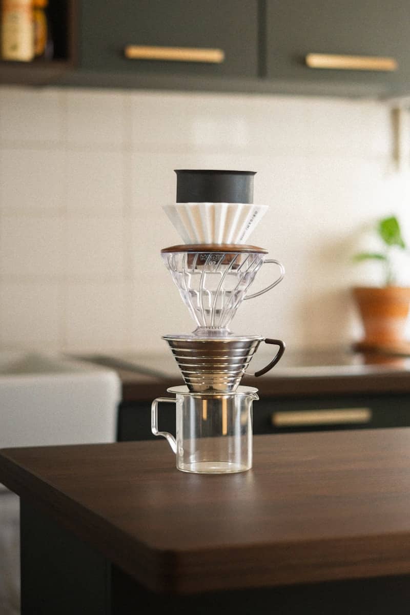 Coffee brewing equipment is stacked neatly.