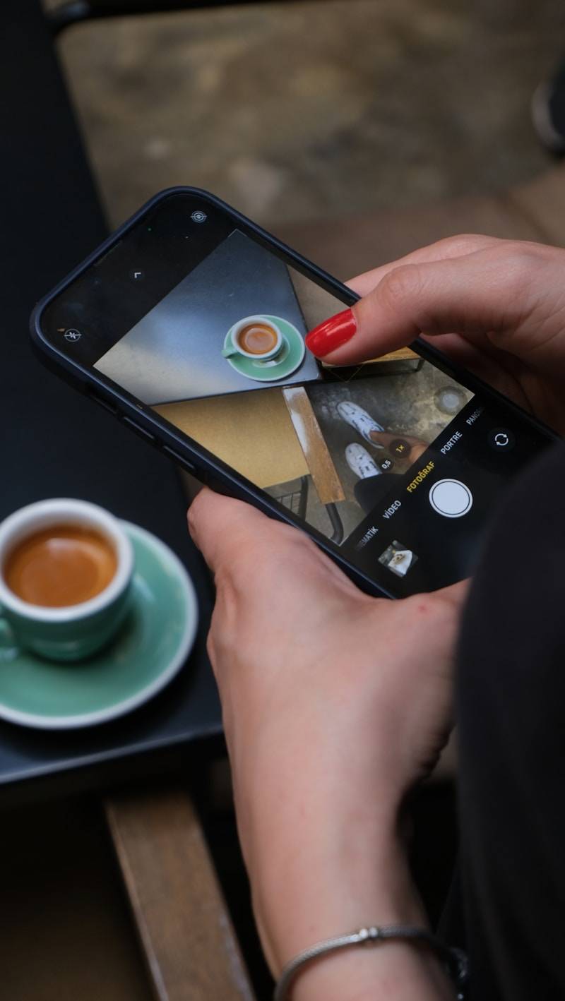 Someone is taking a photo of their coffee.