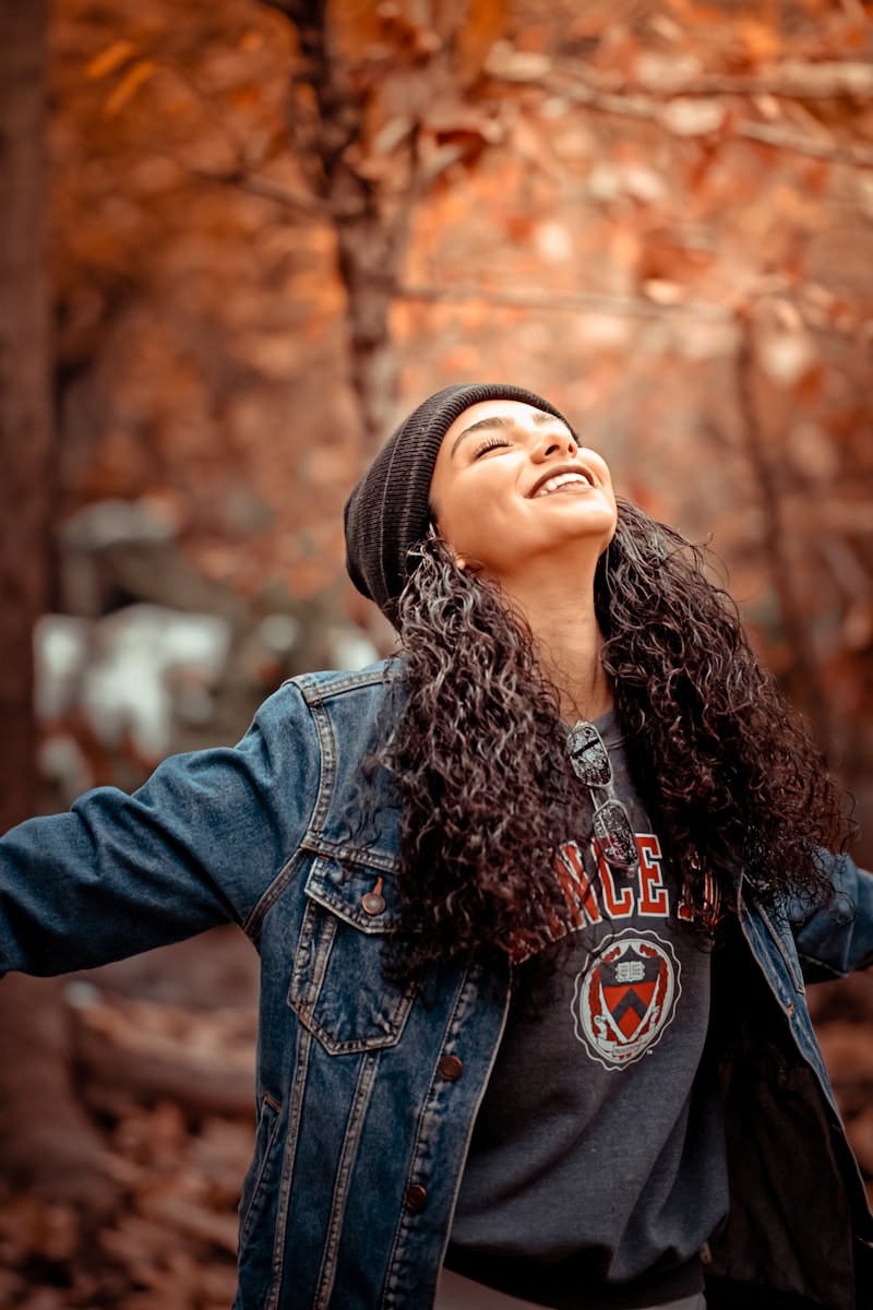 woman wearing blue denim button-up jacket