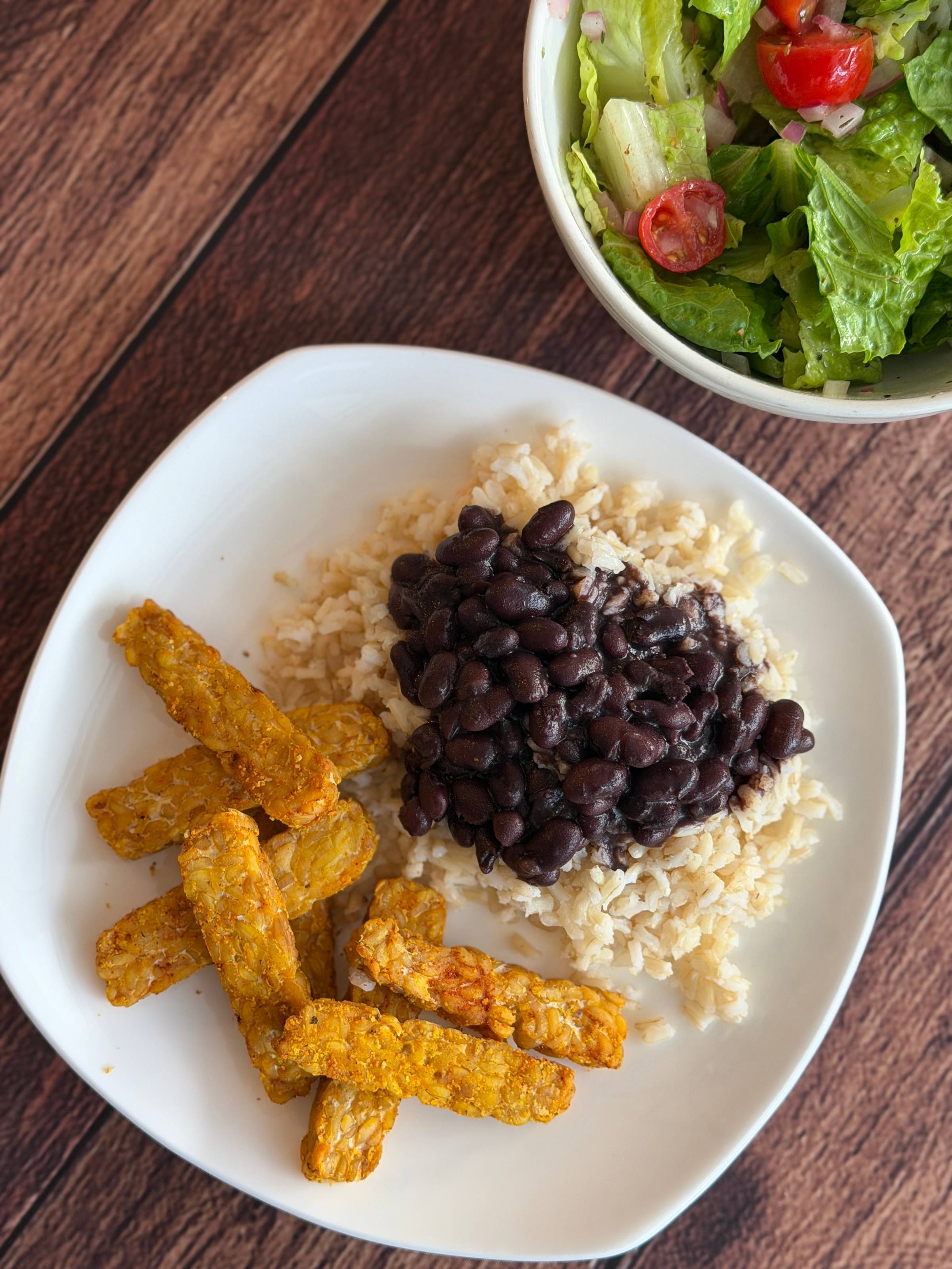 Cuban black beans, rice, and tempeh with a side salad