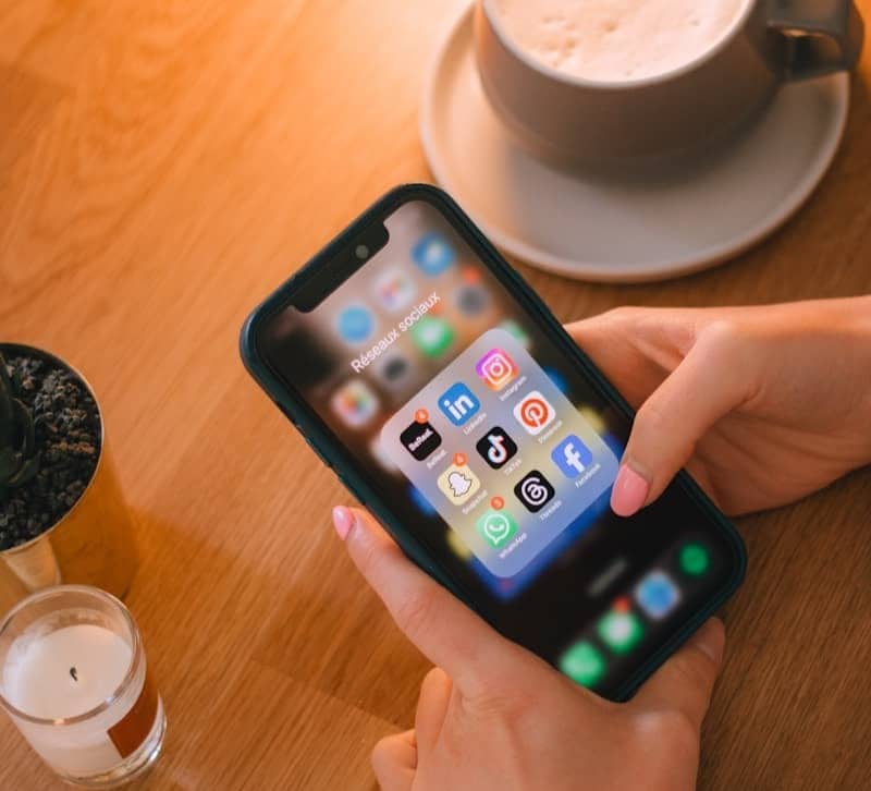 Someone is using their phone with social media apps.