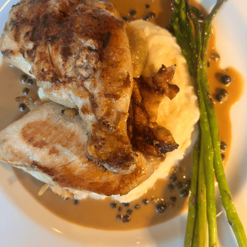 Chicken au poivre with aligot potato, asparagus and peppercorn jus