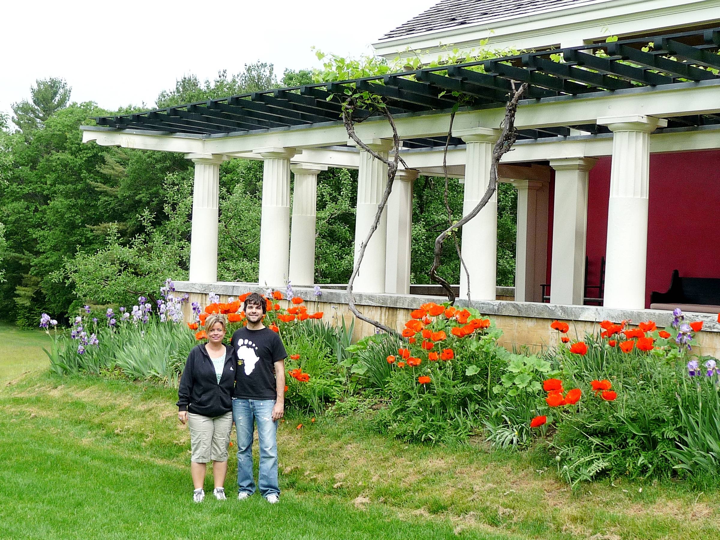 John and Tricia standing in front of home.