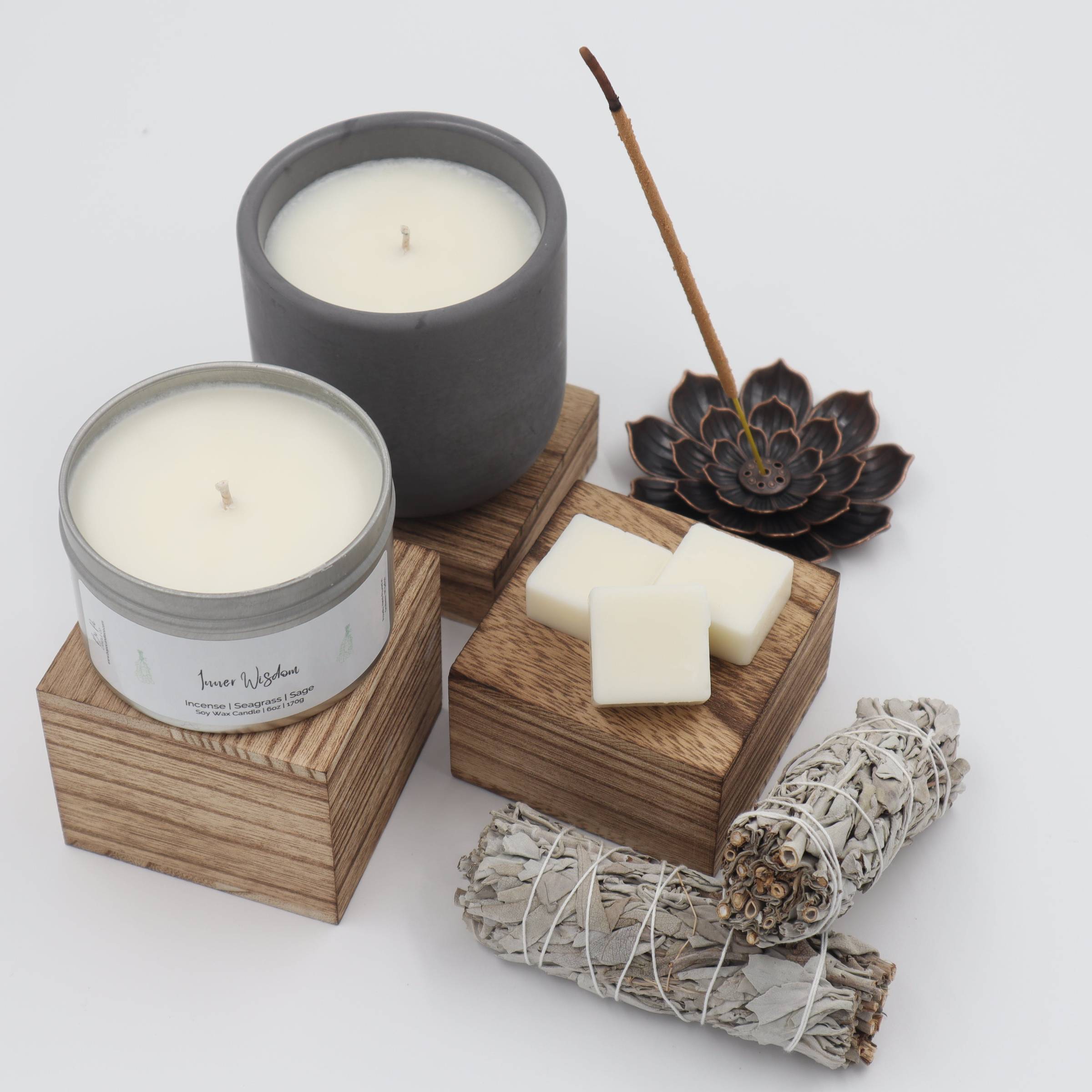 white candle in clear glass holder