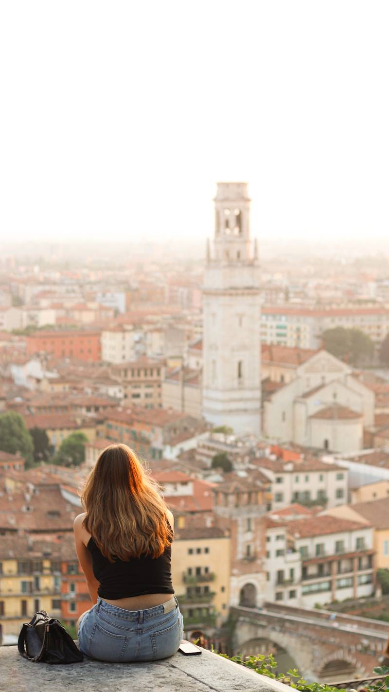 Woman enjoying a view of a european city.