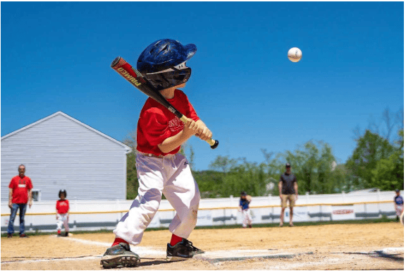 This is an image of a boy hitting a baseball.
