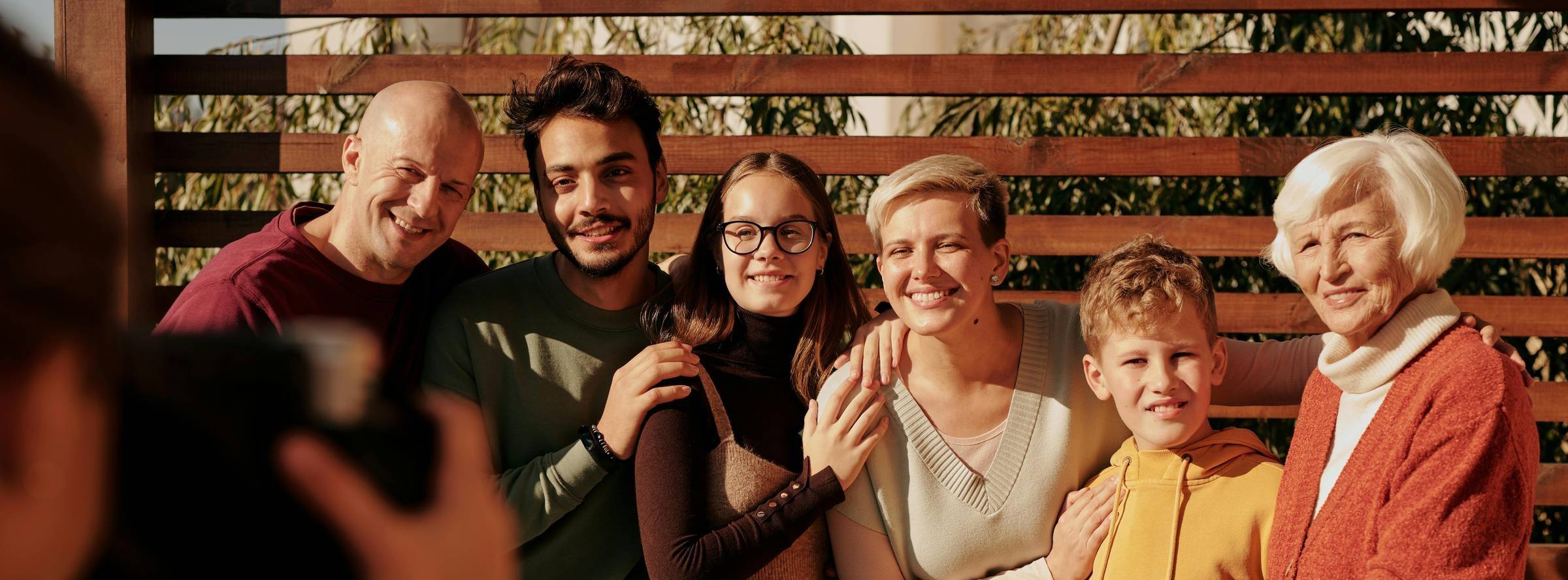 multi generational family posing for photo