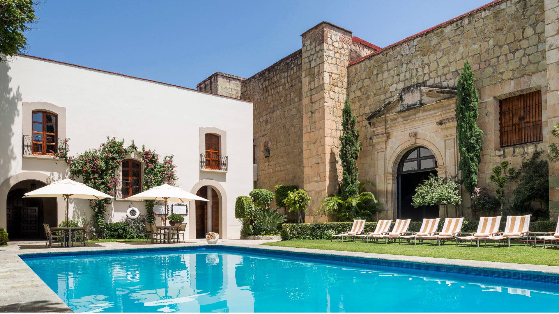 A view of the pool and colonial architecture at the Hotel Quinta Real Oaxaca