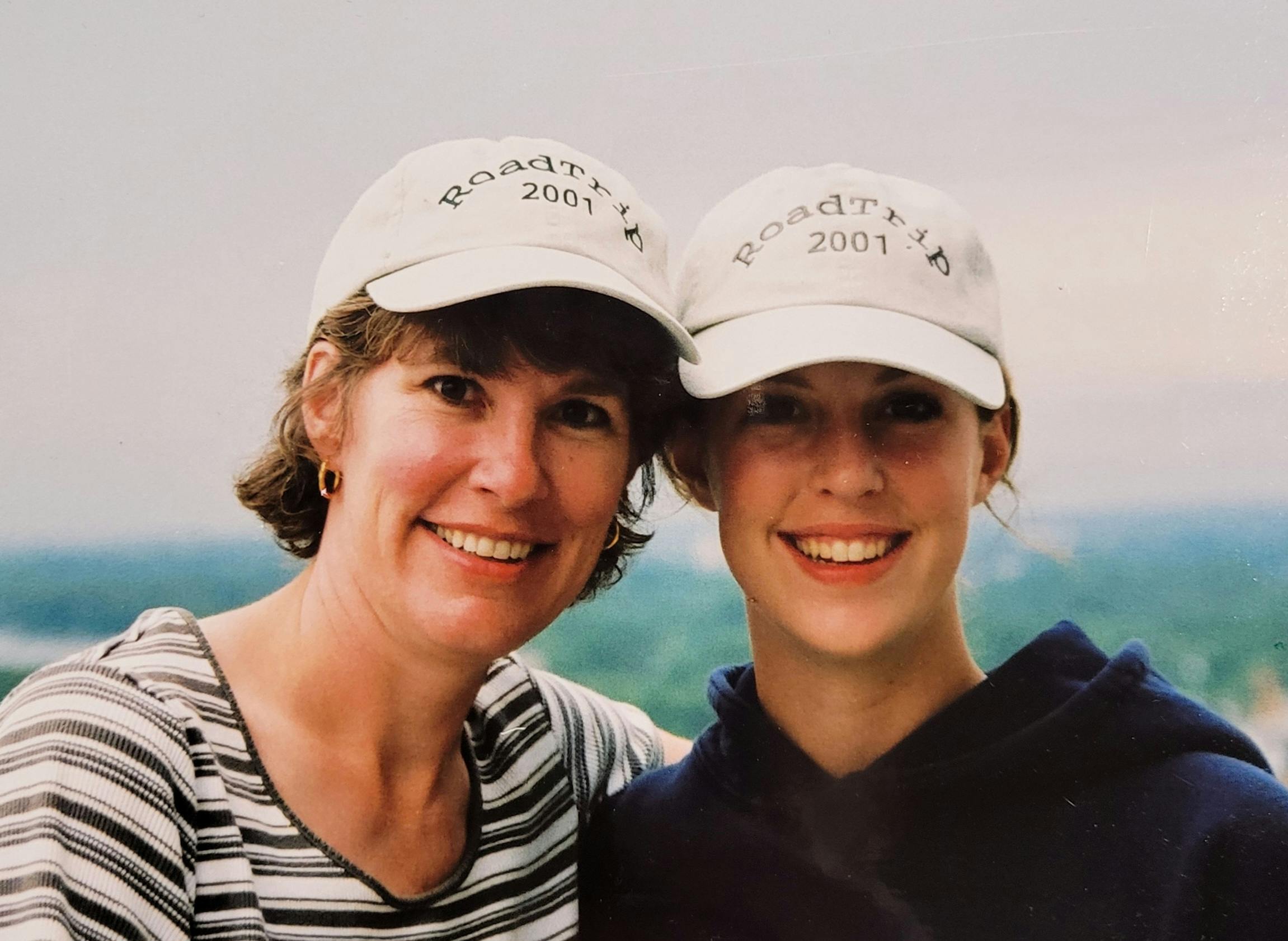Photo of me and my mom in our custom road trip hats