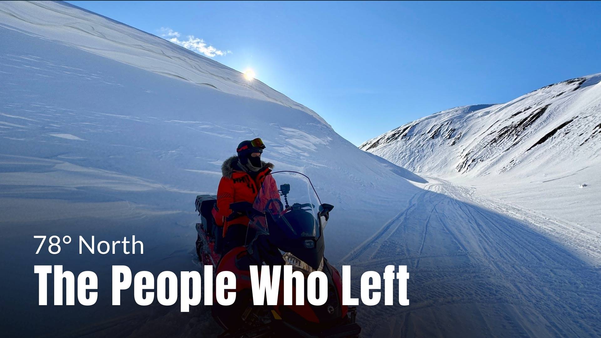 A guy on snowmobile far out in the Svalbard nature