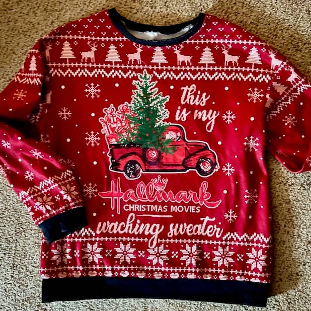 Christmas sweater reading "This is my Hallmark Christmas Movies waching sweater."