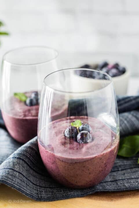 serving bowl with pineapple fluff topped with two cherries