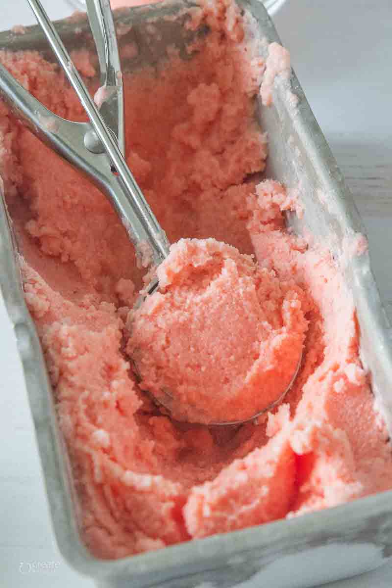 strawberry trifle layered in a trifle bowl